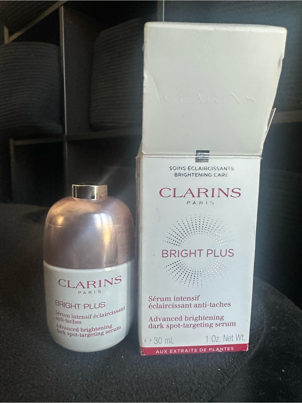 Clarins Brightening Serum Bottle in White and Rose Gold